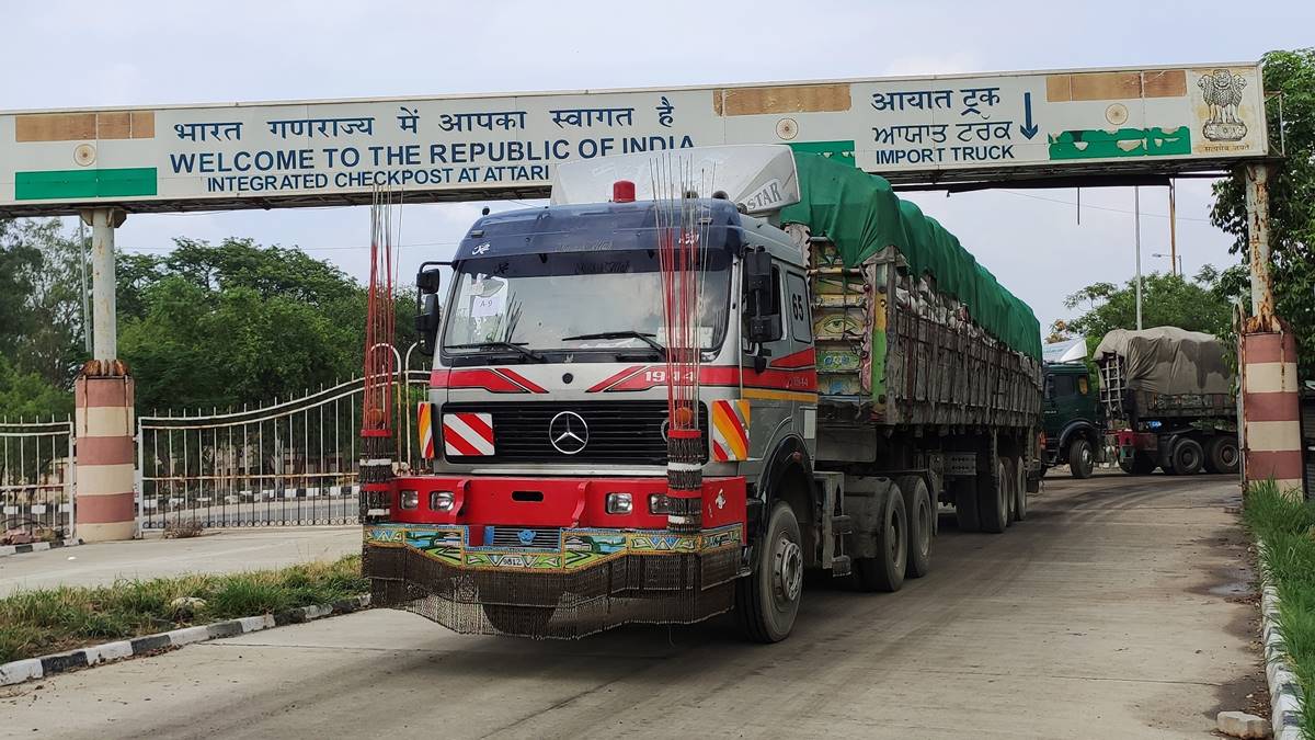 Trucks carrying the next consignment of wheat leave the Attari-Wagah border